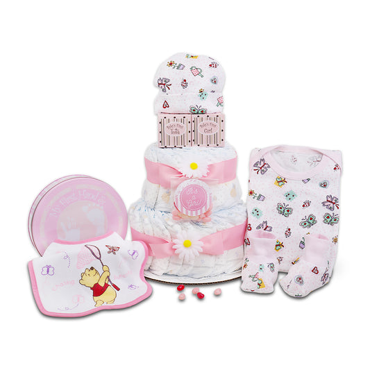 Baby gift set with diaper cake, bib, booties, and hat on a white background
