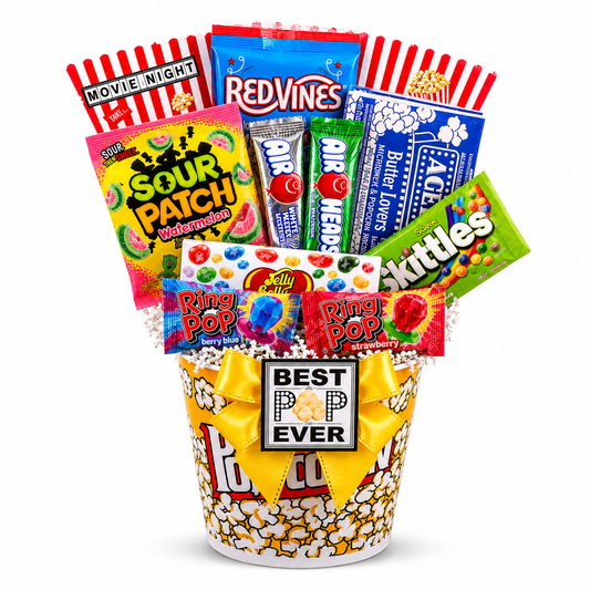 Assorted candy and popcorn gift basket with colorful packaging on a white background