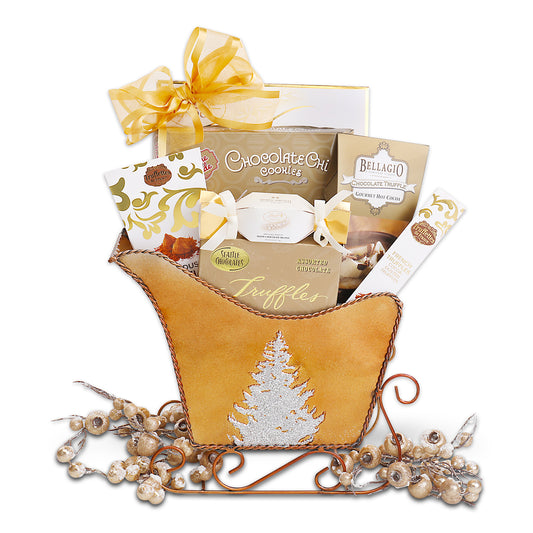 Gift basket with a decorative sleigh, featuring chocolate truffles and other treats on a white background.