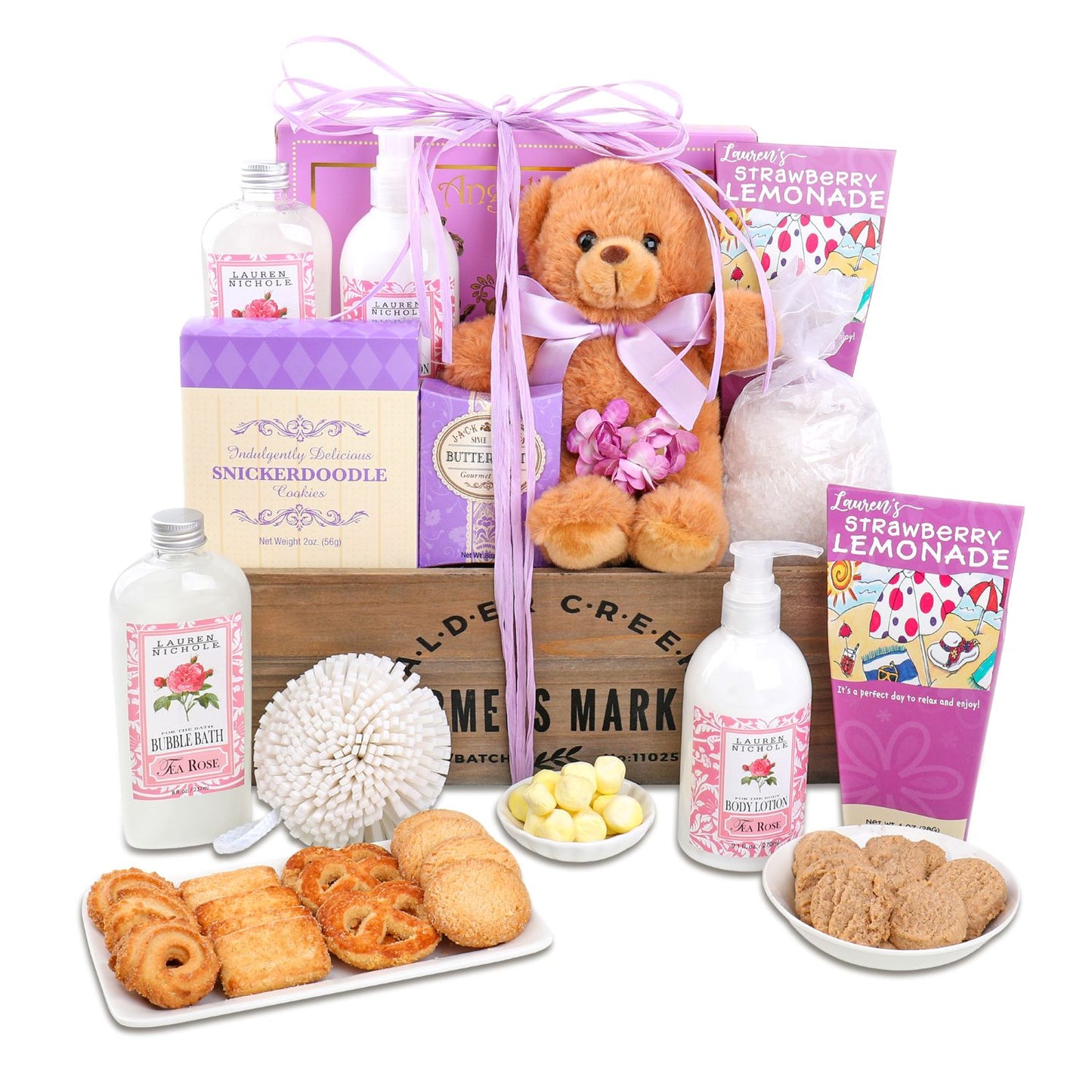 Gift basket with teddy bear, cookies, and bath products on a white background