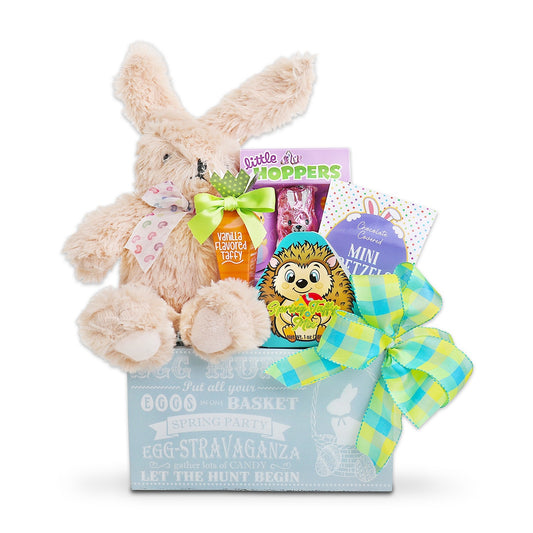 Easter gift basket with plush bunny, toys, and a colorful bow on a white background