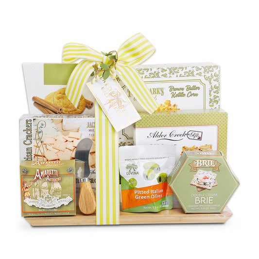 Gourmet gift basket with various food items on a white background