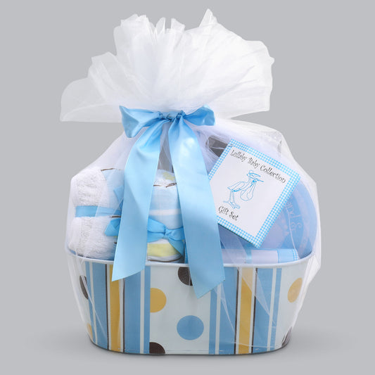 Baby gift set with white blanket, blue ribbon, and baby items in a basket on a gray background