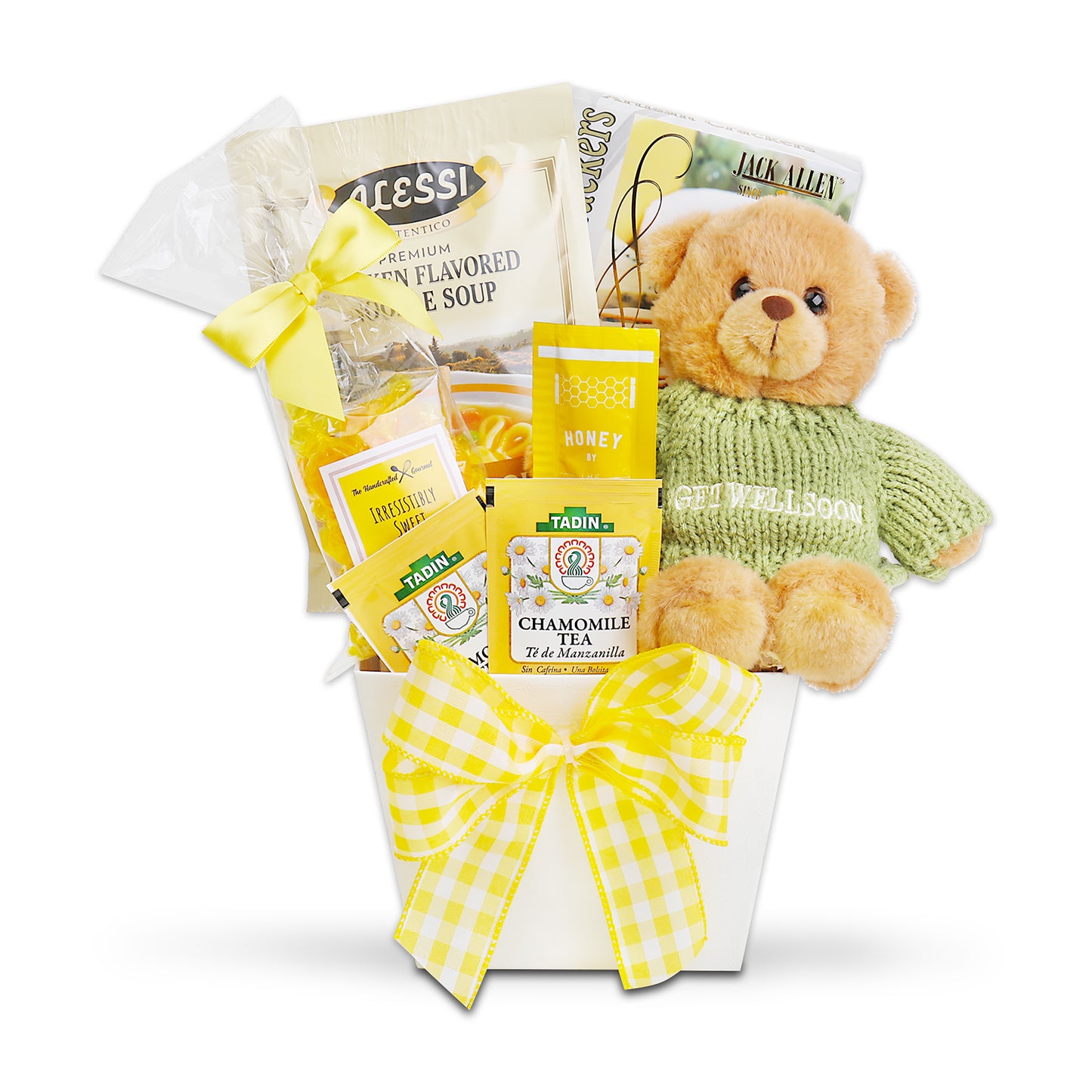 Gift basket with a teddy bear, tea packages, and snacks on a white background