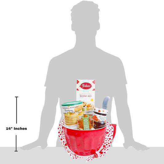 Silhouette of a person with a large red mixing bowl containing food items for scale