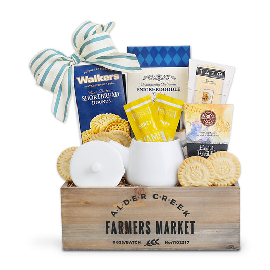 Gift basket from Alder Creek Farmers Market with cookies, tea, and other items.