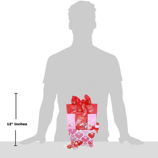 Silhouette of a person with a gift box for size reference, showing 12 inches.