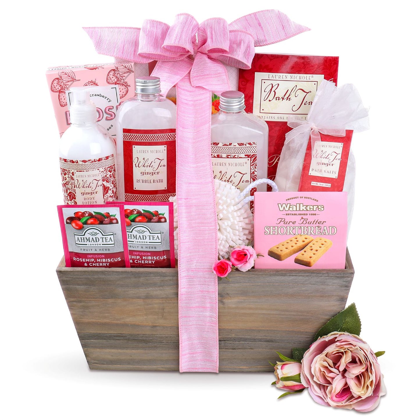 Gift basket with bath products, tea, and cookies on a white background
