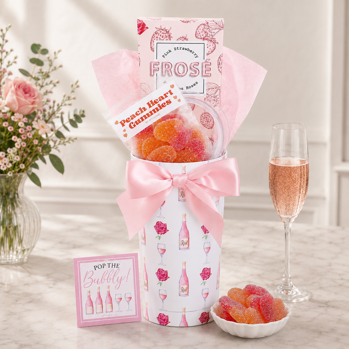 Froés peach heart gummies in a decorative box with a bow, surrounded by flowers