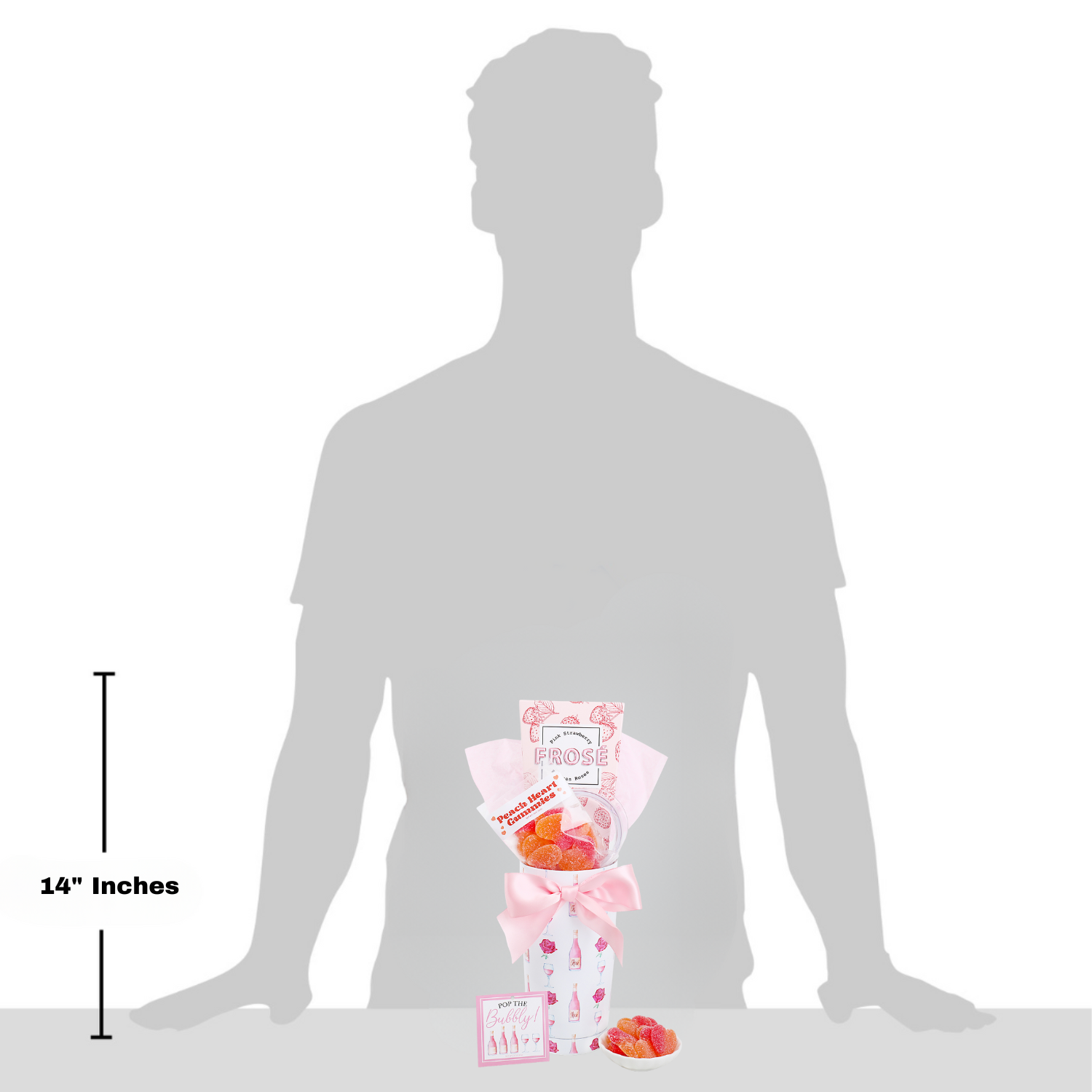 Silhouette of a person with a bouquet of flowers and packaging, showing the size relative to a 14-inch measurement.