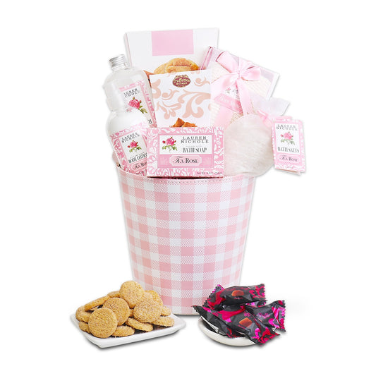 Gift basket with cookies, soap, and other items on a white background
