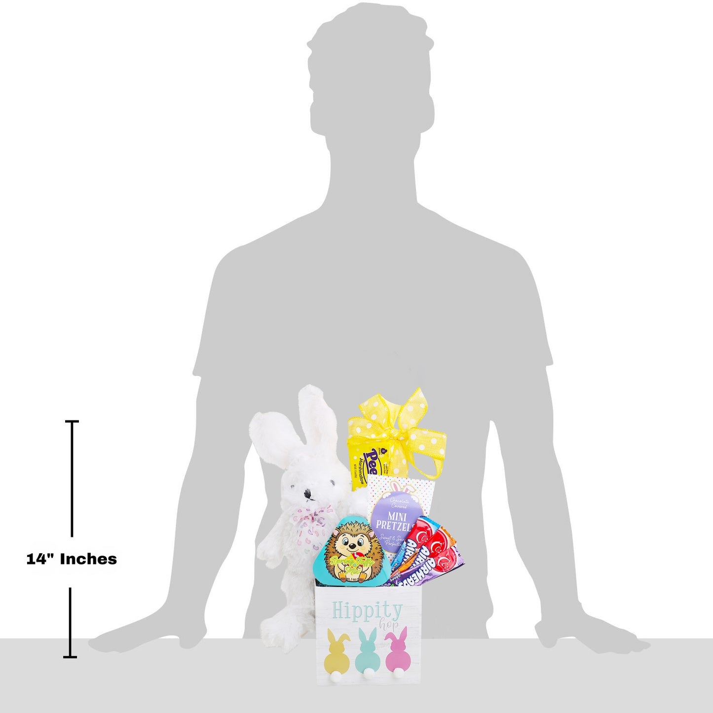 Measurement chart showing a toy and candy package with a person's silhouette for scale.