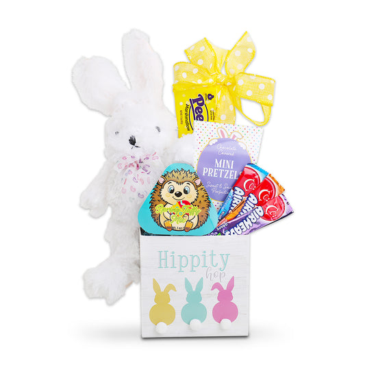 White plush bunny with a box of candy and a yellow bow on a white background