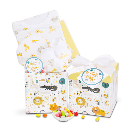 Baby gift set with baby blanket, box, and candy on a white background