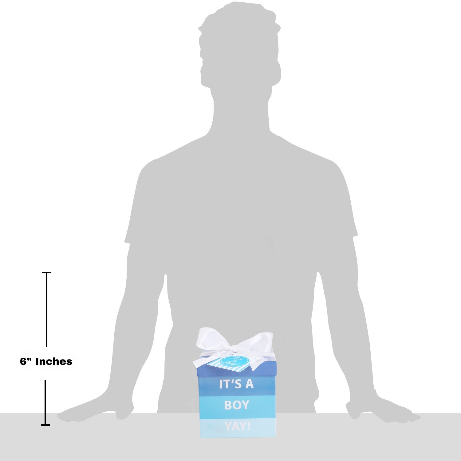 Silhouette of a person with a baby shower gift box labeled 'It's a Boy' for scale.