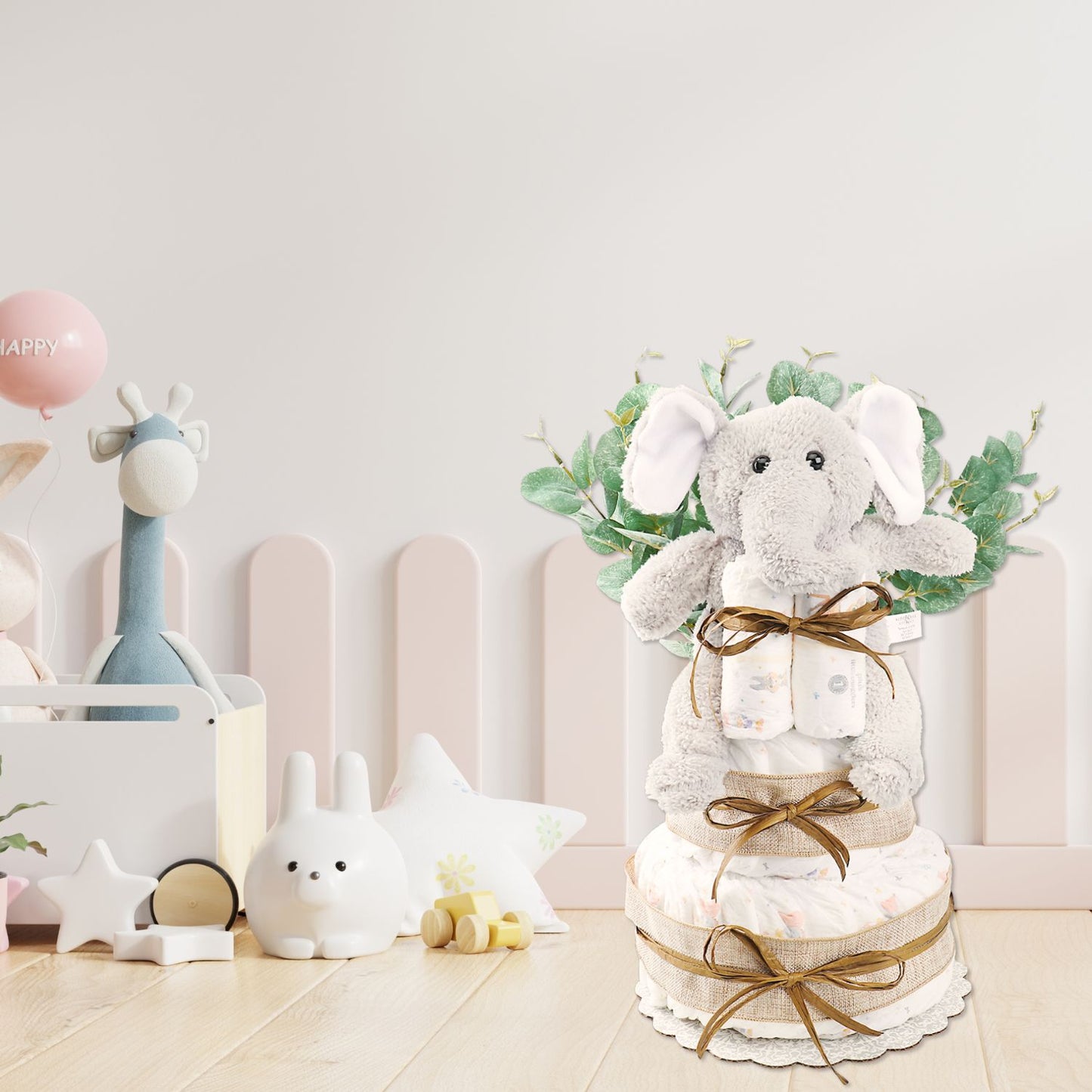 Diaper cake with plush toy and greenery in a baby room setting