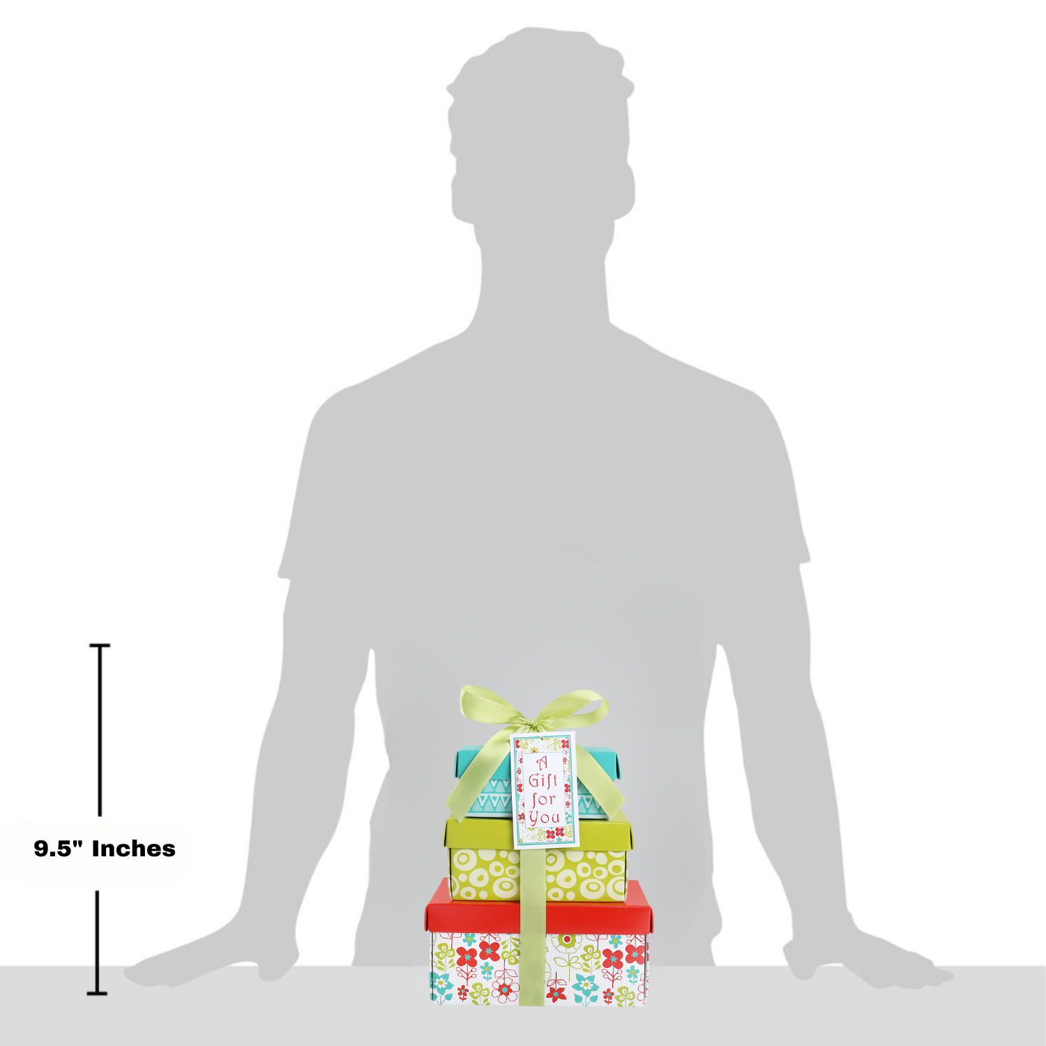 Stack of gift boxes shown next to a silhouette of a person for size reference.