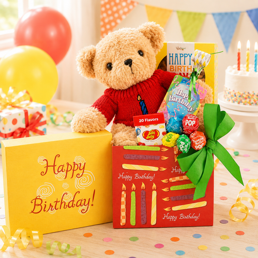 Birthday gift set with teddy bear, candy bouquet, and cake with candles on a polka dot tablecloth.
