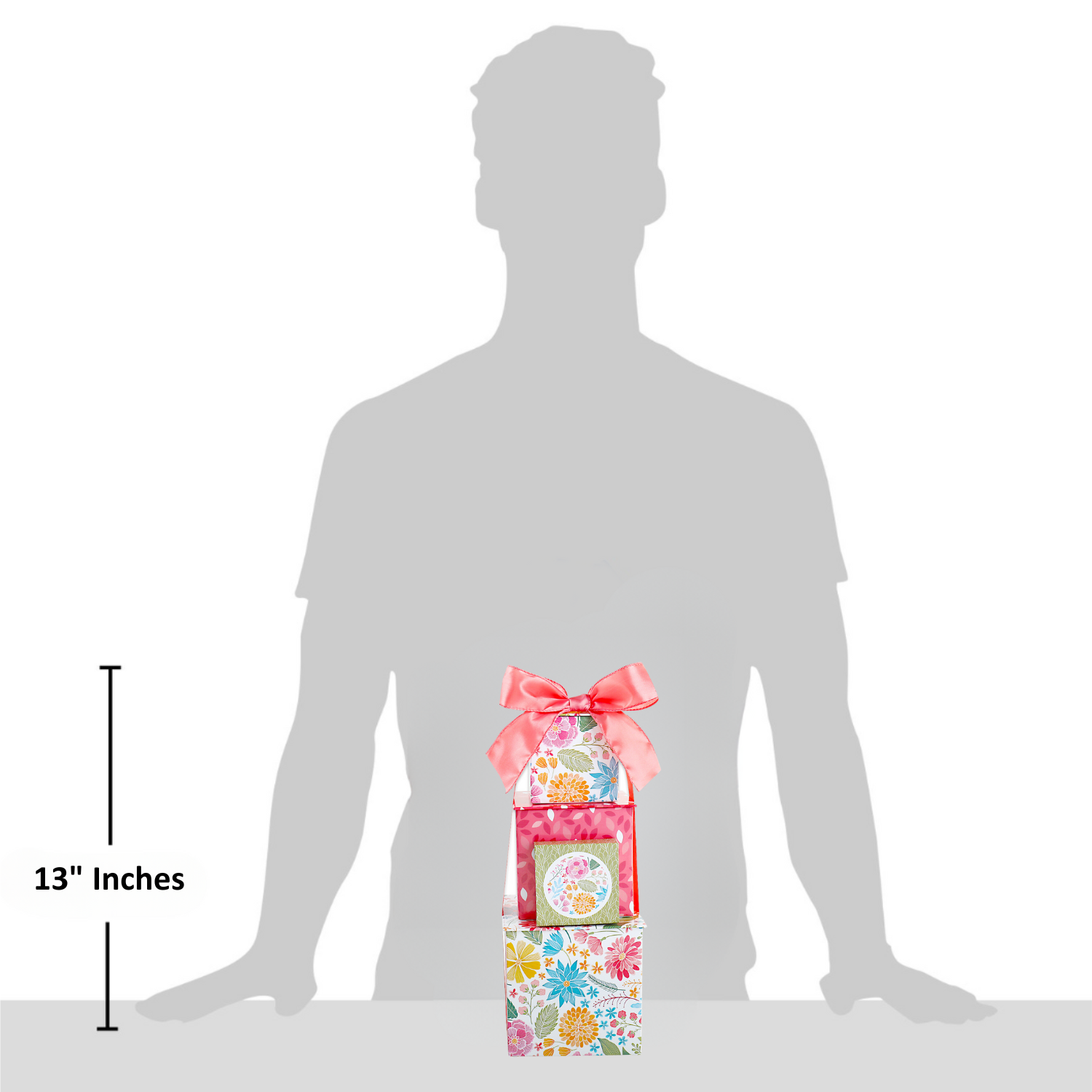 gift tower displayed in front of grey man figure to illustrate size