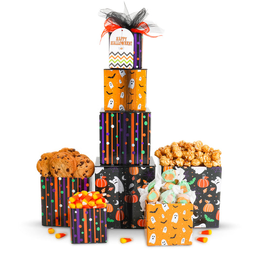 A Halloween-themed gift box set on a white background, featuring stacked patterned boxes with candyand cookies