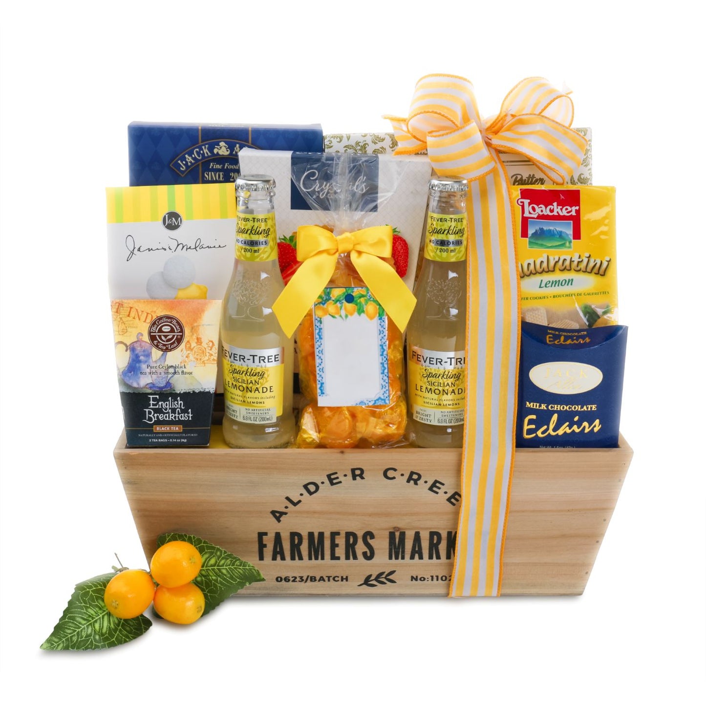 Gift basket with snacks, drinks, and a bow on a white background