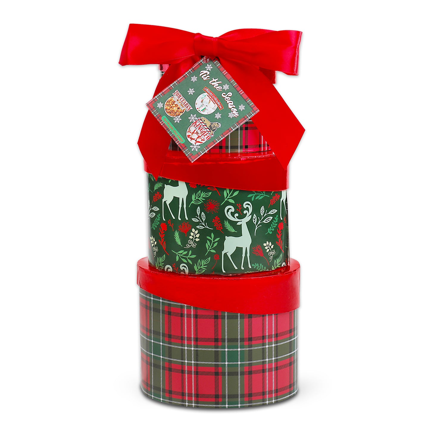Stack of Christmas-themed gift boxes with a red ribbon and tag on a white background