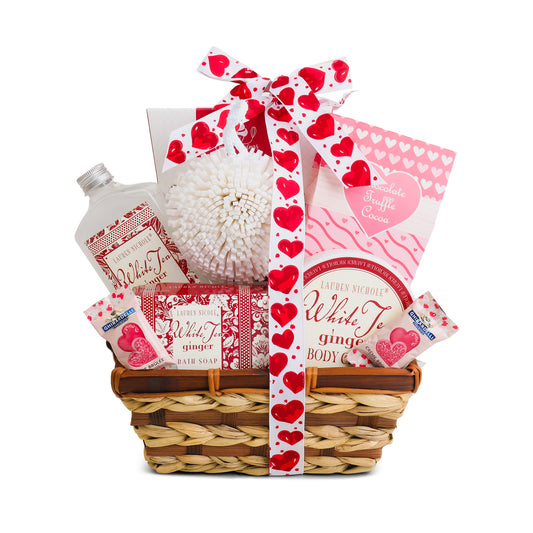 Gift basket with Valentine's Day-themed items including soap, lotion, and a candle.